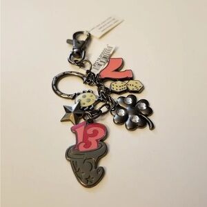 2013 NWOT Disney parks key fob. Lucky 7, 13, Clover, dice, horseshoe.